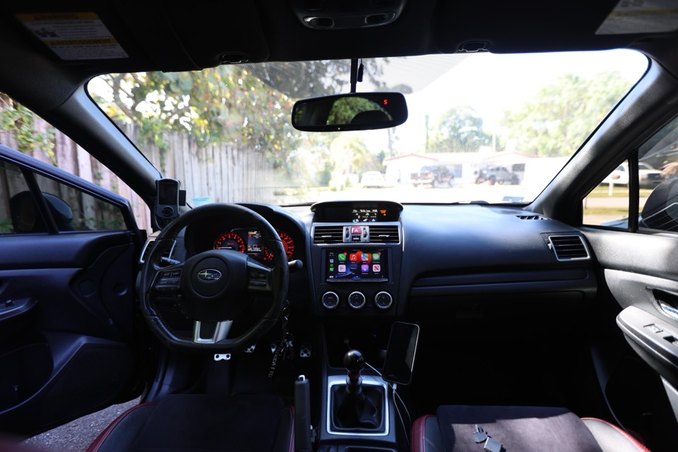 A clean vehicle interior with an upgraded head unit that looks completely factory-installed